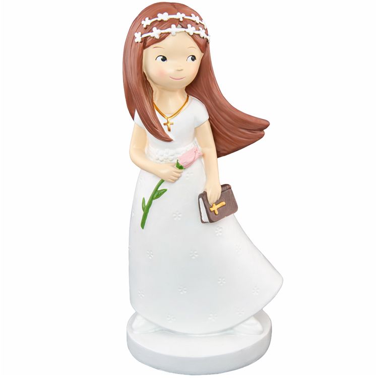 Figur Kommunion Mädchen im weißen Kleid mit langen, braunen Haaren Blume und Bibel in der Hand und mit weißem Blumenkranz im Haar vor weißem Hintergrund.