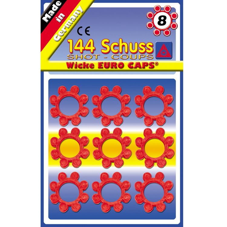 Spielzeug-Revolver mit Spielzeug-Munitionsringen im Hintergrund.