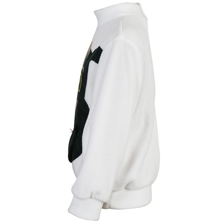 Kind trägt weißen Pullover mit Drachenmotiv und aufklappbarem Maul, fröhlich lachend.