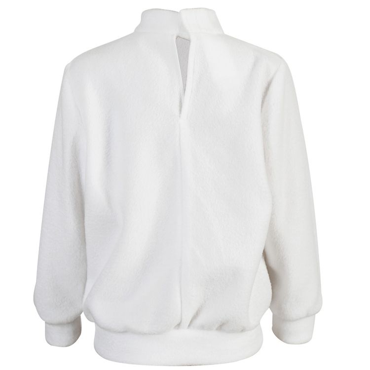 Kind trägt weißen Pullover mit Drachenmotiv und aufklappbarem Maul, fröhlich lachend.