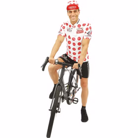 Mann im gepunkteten Kostüm lachend auf Fahrrad.