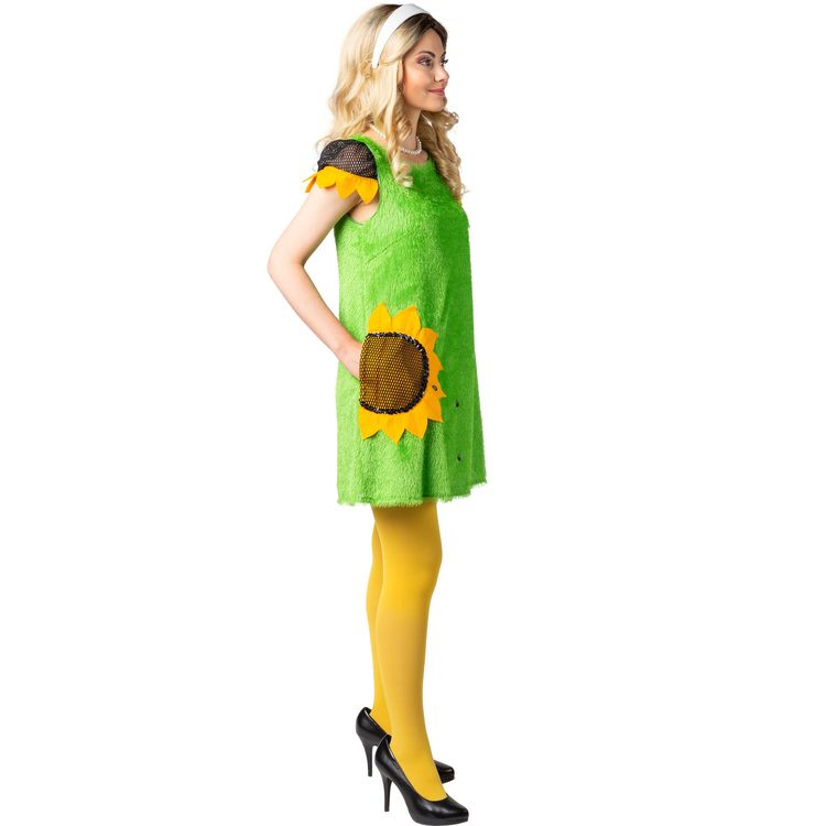 Frontansicht des Damenkostüms: Die Frau trägt ein grünes Kleid mit Sonnenblumenmotiv, gelbe Strumpfhosen und schwarze Pumps. In der Hand hält sie eine passende Tasche in Form einer großen, gelben Blüte.