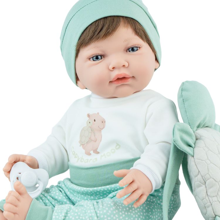 Puppe Mila mit Produktinformationen, inklusive 5-teiligem Set, Schnuller und Zubehör.