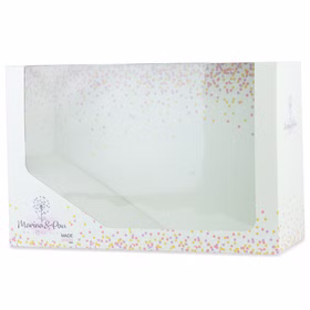 Original Verpackung der Babypuppe Lia mit Sichtfenster und buntem Konfetti-Design.