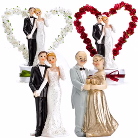 Übersicht verschiedener Tortenaufsätze mit Hochzeitspaaren und Rosenherzen in Weiß und Rot sowie Jubiläumsfigur zur goldenen Hochzeit.