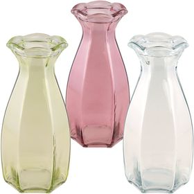 Grüne Glasvase Corolle mit geschwungener Form und dekorativ gewelltem Rand auf hellem Hintergrund.