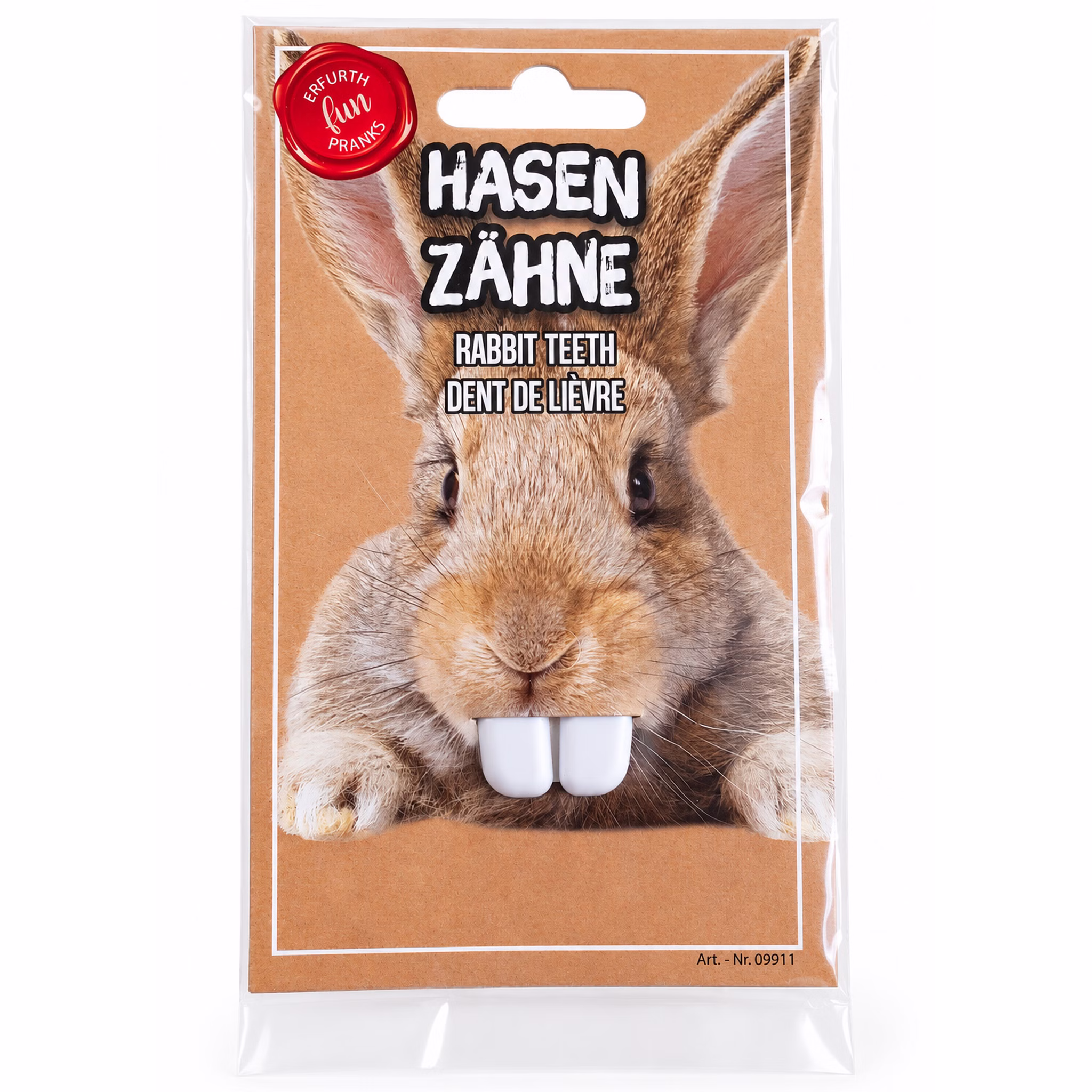 Weiße Hasenzähne als Kostüm-Zubehör in Originalverpackung mit Hasenmotiv, Frontansicht auf sauberem weißem Hintergrund.